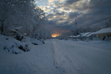 Snow covered road way sunrise