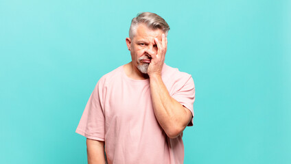 old senior man feeling bored, frustrated and sleepy after a tiresome, dull and tedious task,...