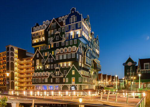 Zaandam, Netherlands - May, 11 2018; Famous touristic Inn hotel in Zaanstad with a exterior of old dutch houses, The Netherlands in the evening.
