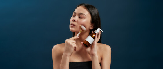 Fototapeta premium Brunette with cosmetic devices in the studio