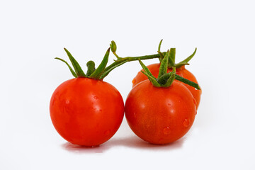 Fresh red tomatoes on a white background.