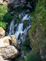 Naklejka premium Waterfall below the New Bridge at Ronda Spain