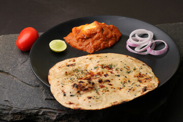 Paneer Butter Masala or Cheese Cottage Curry  served with naan or tandoori roti.