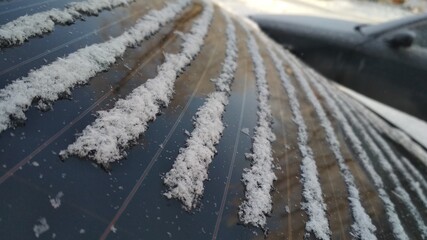 lines of the snowflakes between window defroster lines of rear window in the winter cold weather 