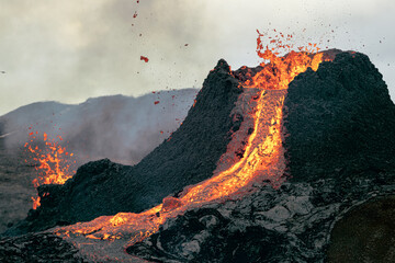 Hot lava is erupting from the volcano in Iceland in March 2021.
 - Powered by Adobe