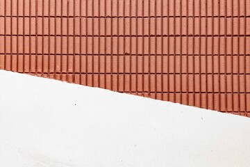 Red-brown terracotta block wall and white cement wall pattern and background seamless