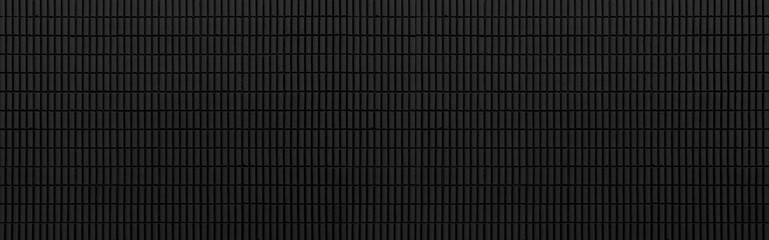 Panorama of Vintage black brick tile wall pattern and background seamless