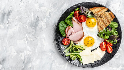 healthy breakfast. English breakfast plate of fried eggs, ham and toast.banner, menu recipe place for text, top view