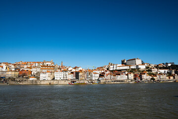 Fototapeta na wymiar Porto, Portugal Old city skyline from across the Douro river on a Sunny warm day