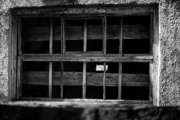old window with bars black and white