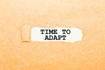 text TIME TO ADAPT on a torn piece of paper, business concept