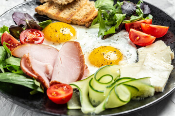 English breakfast toast, egg, bacon and vegetables. Delicious breakfast or snack on a light background, Food recipe background. Close up