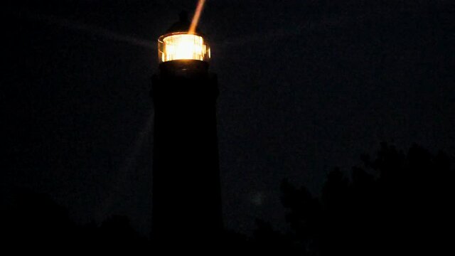 The lighthouse is shining into darkness. Prerow on the Darss, Vorpommersche Boddenlandschaft National Park, Germany 