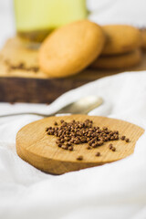Seeds for buckwheat tea on wooden plate