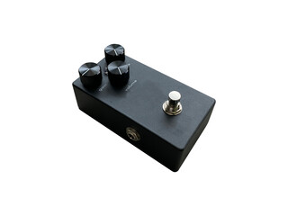 Isolated black sand texture overdrive and black knob stompbox electric guitar effect on white...