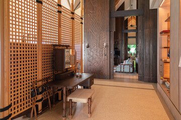 Luxurious interior of a very expensive rich water villa in the Maldives, decorated with natural wood.