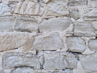 Texture of natural stones bricks wall. Outdoor background. House wall. 