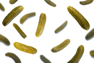 . Lots of fresh pickled cucumbers are flying in the air. Isolation on a white background. Levitation