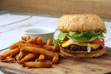 Freshly made giant hamburger sandwich with cheese and vegetables