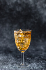 alcohol cocktail with ice in a transparent glass delicious cold drink top view copy space for text food background rustic image