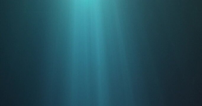 Sunbeams shining through blue water