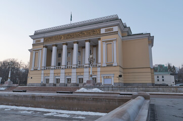 Naklejka premium 03.19.2021 Almaty, Kazakhstan. The old Abai Opera and Ballet Theater in the city center, opposite the Almaty Hotel in the spring, early in the morning.
