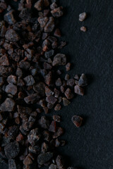 rock himalayan salt on black stone surface