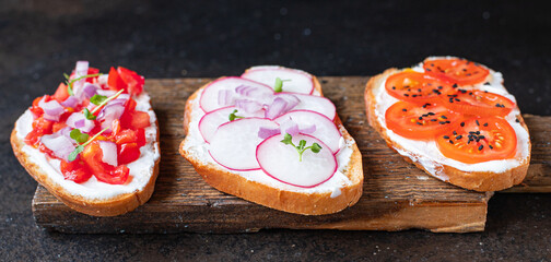 bruschetta vegetable tomato, radish onion cream cheese on the table cooking meal snack top view copy space food background 