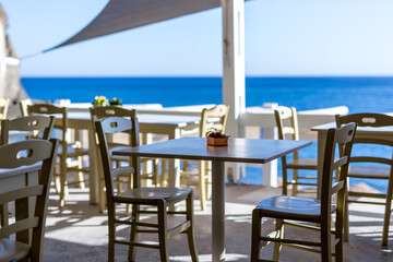 Restaurant furnishings outside with view of the ocean