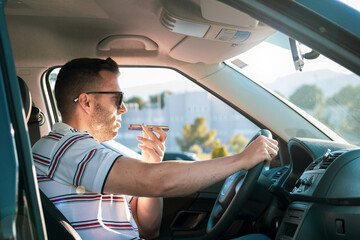 adult man driving a car while sending an audio