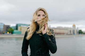 Outdoors portrait of beautiful young woman. Selective focus.