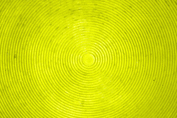 Disco background - concentric circles in lime. Textured background in the form of circles with a common center. Retro wallpaper.