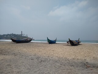 wooden fishing boat on the beach, seascape view, Kovalam beach Thiruvananthapuram Kerala