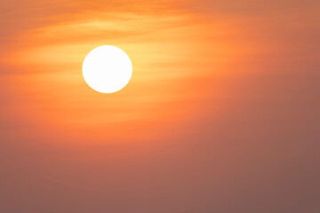 Big sun at sunset in the orange yky