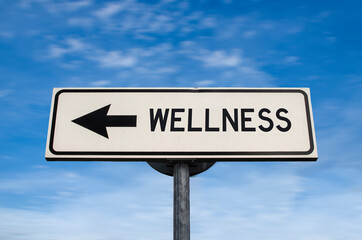 Wellness road sign, arrow on blue sky background. One way blank road sign with copy space. Arrow on a pole pointing in one direction.