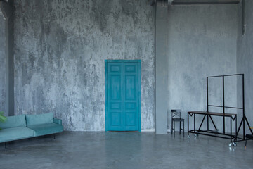 blue sofa, coat hangers and aquamarine door