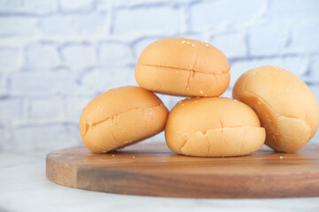 close up of stack of baked bread on table 