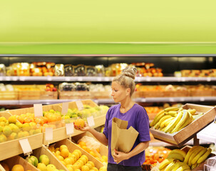 Woman buying fruits at the market
