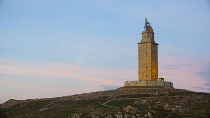 Fototapeta na wymiar Hercules Tower in La Coruña at sunset