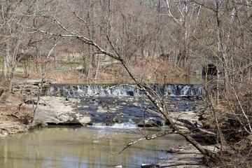 A view of the waterfall though the bare branches.

