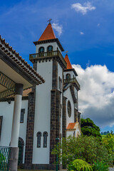 Fototapeta na wymiar Scenic view of the church of Our Lady of Joy in small town Furnas, Sao Miguel island, Azores, Portugal