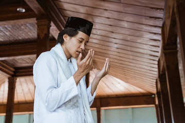 Muslim man worships and prays for Allah in the mosque