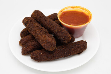 Fried Polenta Sticks with Marinara Sauce on a White Plate