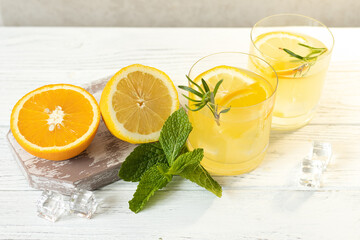 Glasses with citrus lemonade, summer soft drink, top view