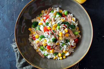 Rice salad with tuna and vegetables. Top view with copy space. Healthy food.