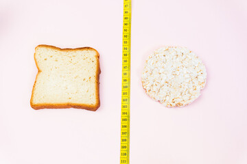 Choice: Slices of wholemeal bread or Round crunchy rice crispbreads. Diet concept. Flat lay