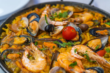 Spanish seafood Paella de Marsico, with scampi mussels reis, Safran, tomato, Paella Marinera
