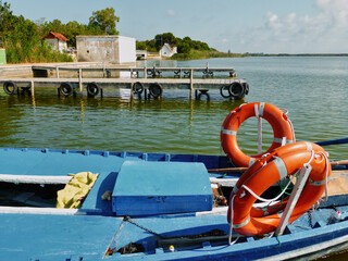 Boats moored at small wooden piers in the Albufera of Valencia, Spain