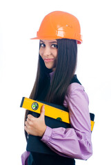 Attractive girl in helmet with level