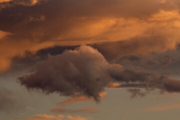 Beauty in nature. Natural backgrounds. Cloudscape. Dramatic sky with clouds at sunset. Beautiful texture and dusk colors.